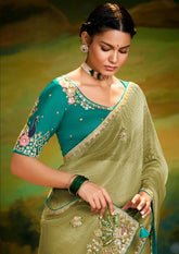 India Silk Olive Green Sarees Crafted From Delicate Tissue Organza Feature Beautiful Embroidery With Traditional Butti